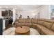 Living room with a comfortable sofa, area rug, view of staircase and kitchen at 2700 Norwich Trce, Snellville, GA 30078