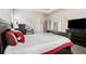 Bedroom featuring neutral carpet, tray ceilings, and an en suite bathroom at 2700 Norwich Trce, Snellville, GA 30078