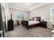 Cozy bedroom with tray ceilings, carpet, and large window at 2700 Norwich Trce, Snellville, GA 30078
