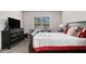 Bright bedroom with carpet, TV and large window at 2700 Norwich Trce, Snellville, GA 30078