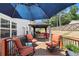 Outdoor patio featuring patio furniture, umbrella and a covered seating area at 2700 Norwich Trce, Snellville, GA 30078