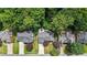 Aerial view of the property surrounded by mature trees and manicured lawns at 4955 Day Lily Nw Way, Acworth, GA 30102