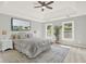 Relaxing bedroom with a ceiling fan, two windows, a comfortable bed and a decorative rug at 4955 Day Lily Nw Way, Acworth, GA 30102