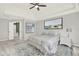 Serene bedroom showcases a tray ceiling, and is decorated with a plush rug and artwork at 4955 Day Lily Nw Way, Acworth, GA 30102