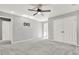 Spacious bedroom with double closets, neutral carpet, and fixtures ready for a wall-mounted television at 4955 Day Lily Nw Way, Acworth, GA 30102
