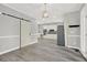Spacious dining area featuring a sliding barn door and modern kitchen appliances in an open layout at 4955 Day Lily Nw Way, Acworth, GA 30102