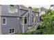 Back exterior showcasing multiple windows, a deck and access to a backyard at 4955 Day Lily Nw Way, Acworth, GA 30102