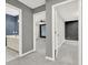 Hallway featuring multiple rooms and a bathroom sink and vanity with marble floor at 4955 Day Lily Nw Way, Acworth, GA 30102