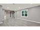Open living room with lots of natural light and beautiful gray flooring at 4955 Day Lily Nw Way, Acworth, GA 30102