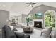 Bright, open living room with vaulted ceiling, fireplace, and large windows overlooking the backyard at 4955 Day Lily Nw Way, Acworth, GA 30102