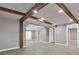 Spacious living room with hardwood floors, exposed ceiling beams, recessed lighting, and neutral gray walls at 4955 Day Lily Nw Way, Acworth, GA 30102