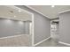 Open concept living room with gray walls and hardwood floors, bright and airy space at 4955 Day Lily Nw Way, Acworth, GA 30102