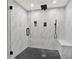 Contemporary shower with marbled tile, black hardware, and a built-in bench at 4955 Day Lily Nw Way, Acworth, GA 30102
