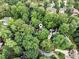 Aerial view of property nestled between mature trees in a private setting at 80 Stratford Ne Pl, Atlanta, GA 30342