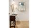 Traditional bathroom features a decorative mirror and sink vanity below a window with natural light at 80 Stratford Ne Pl, Atlanta, GA 30342