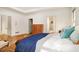 Bright bedroom featuring hardwood floors and a tray ceiling at 80 Stratford Ne Pl, Atlanta, GA 30342