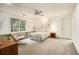 Spacious bedroom with a large window, decorative painting, and a cozy sitting area at 80 Stratford Ne Pl, Atlanta, GA 30342