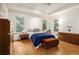 Bedroom with hardwood floors, natural light, and stylish furnishings at 80 Stratford Ne Pl, Atlanta, GA 30342