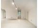 Bonus room with tile flooring, small window, white walls, and neutral color scheme at 80 Stratford Ne Pl, Atlanta, GA 30342