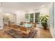 Bright dining room with large windows, modern table, and a decorative rug at 80 Stratford Ne Pl, Atlanta, GA 30342