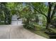 Charming home with a two-car garage surrounded by mature trees at 80 Stratford Ne Pl, Atlanta, GA 30342