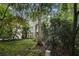 Beautiful home exterior surrounded by lush greenery and mature trees at 80 Stratford Ne Pl, Atlanta, GA 30342