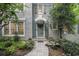 Charming front door with a stone walkway and lush landscaping at 80 Stratford Ne Pl, Atlanta, GA 30342