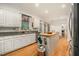 Kitchen with a butcher block island, stainless steel appliances, granite counters, and white cabinets at 80 Stratford Ne Pl, Atlanta, GA 30342