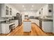 Spacious kitchen featuring white cabinets, granite countertops and stainless steel appliances at 80 Stratford Ne Pl, Atlanta, GA 30342