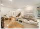 Spacious living room featuring hardwood floors, fireplace, and ample seating at 80 Stratford Ne Pl, Atlanta, GA 30342