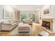 Bright living room with large windows, fireplace, and hardwood floors at 80 Stratford Ne Pl, Atlanta, GA 30342