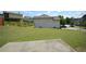 Expansive backyard with lush green grass and a concrete patio, perfect for outdoor activities and relaxation at 829 Still Hill Ln, Lawrenceville, GA 30045