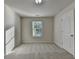 Bedroom with carpet flooring and natural light at 829 Still Hill Ln, Lawrenceville, GA 30045