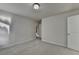Bedroom features neutral-colored carpet, a door, and white walls at 829 Still Hill Ln, Lawrenceville, GA 30045