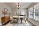 Stylish dining room with modern furnishings, a unique light fixture, and a decorative rug at 829 Still Hill Ln, Lawrenceville, GA 30045