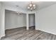 Bright dining room featuring wood flooring, chandelier lighting and doorway at 829 Still Hill Ln, Lawrenceville, GA 30045