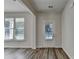 Bright entryway with hardwood floors, a window offering natural light, and a white door at 829 Still Hill Ln, Lawrenceville, GA 30045
