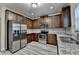 Bright kitchen with stainless steel appliances, granite counters, and ample cabinetry at 829 Still Hill Ln, Lawrenceville, GA 30045