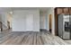 Open-concept living area boasts stylish gray wood flooring and neutral paint, creating a bright and inviting space at 829 Still Hill Ln, Lawrenceville, GA 30045