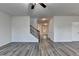 Bright open-concept living room with gray flooring and staircase at 829 Still Hill Ln, Lawrenceville, GA 30045