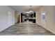 Open concept living room with view to the kitchen featuring stainless appliances at 829 Still Hill Ln, Lawrenceville, GA 30045