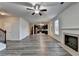 Spacious living room with gray flooring, fireplace, and open to the kitchen at 829 Still Hill Ln, Lawrenceville, GA 30045