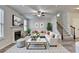 Comfortable living room with fireplace, staircase, ceiling fan and plenty of natural light at 829 Still Hill Ln, Lawrenceville, GA 30045