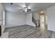 Bright living room featuring a staircase, a ceiling fan and a doorway at 829 Still Hill Ln, Lawrenceville, GA 30045