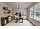 Bright and airy office space with modern furnishings, shelving, and a large window at 829 Still Hill Ln, Lawrenceville, GA 30045
