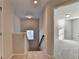 Upstairs landing with natural light, leads to a bedroom and adds a touch of warmth at 829 Still Hill Ln, Lawrenceville, GA 30045