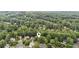 Aerial view of the neighborhood surrounded by lush green trees at 878 Treadstone Overlook, Suwanee, GA 30024