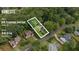 Aerial view of a home at 878 Treadstone Overlook in Suwanee, GA, highlighting the .45 acre lot surrounded by lush greenery at 878 Treadstone Overlook, Suwanee, GA 30024