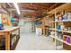 Unfinished basement with ample storage space, work bench, shelving, and potential for customization and future expansion at 878 Treadstone Overlook, Suwanee, GA 30024