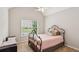 Bedroom with simple design, a wrought iron frame bed, and neutral tones at 878 Treadstone Overlook, Suwanee, GA 30024